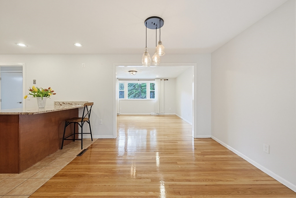 26 Beaver Brook Road Sharon, MA 02067 - Photo 10 of 42 a view of a room with wooden floor table and chairs
