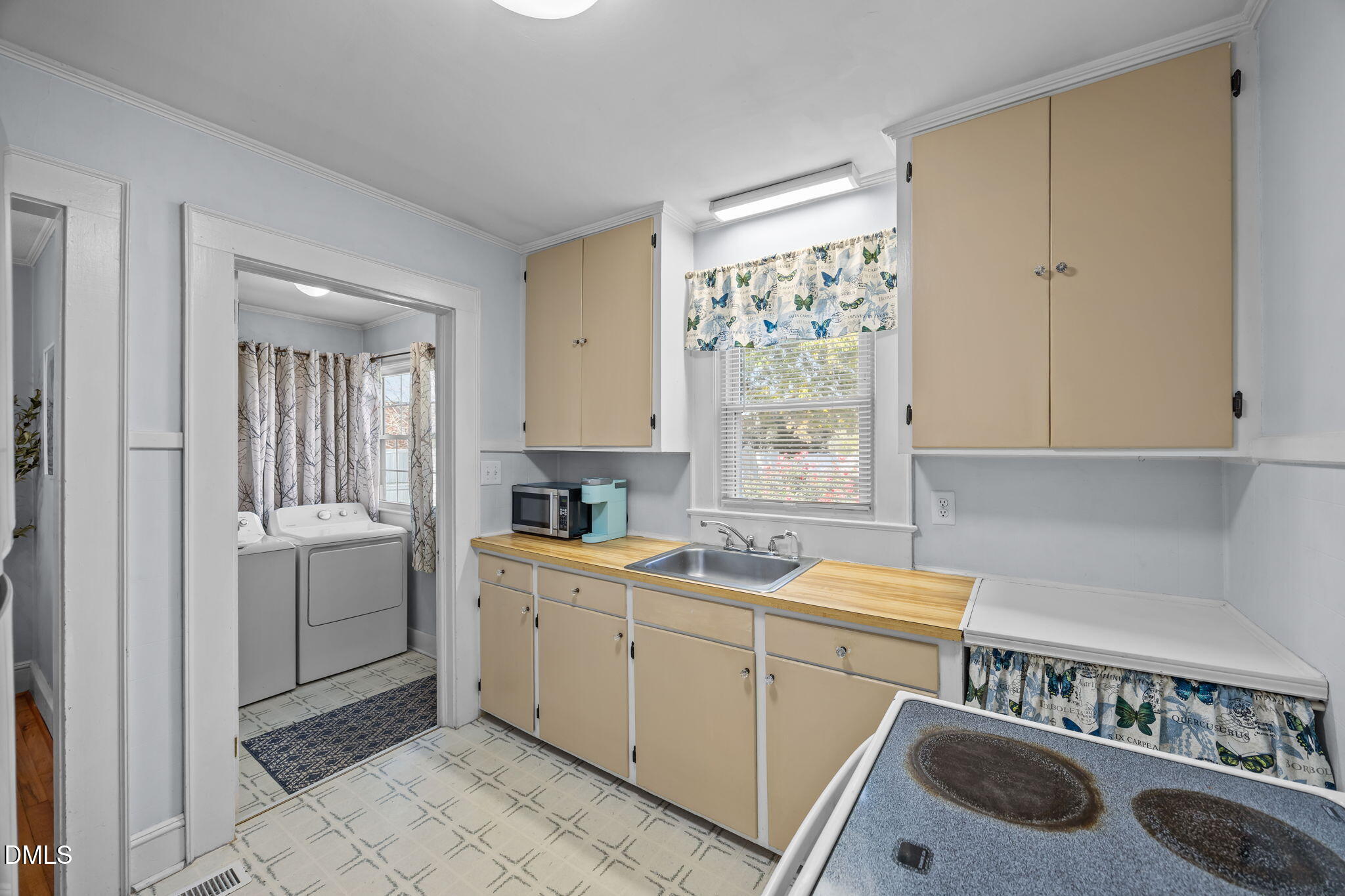 128 Moore Street Graham, NC 27253 - Photo 12 of 45 a utility room with sink dryer and washer