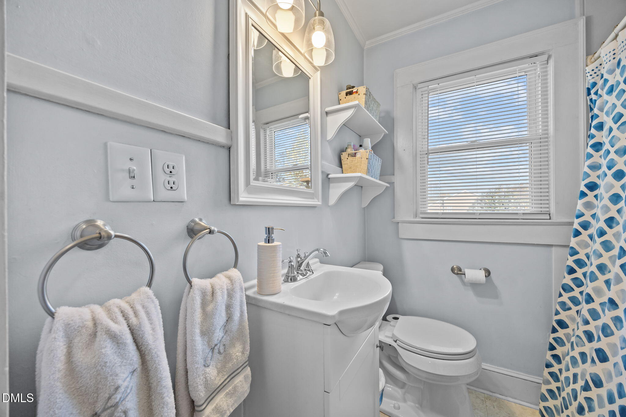 128 Moore Street Graham, NC 27253 - Photo 16 of 45 a bathroom with a sink toilet and a mirror