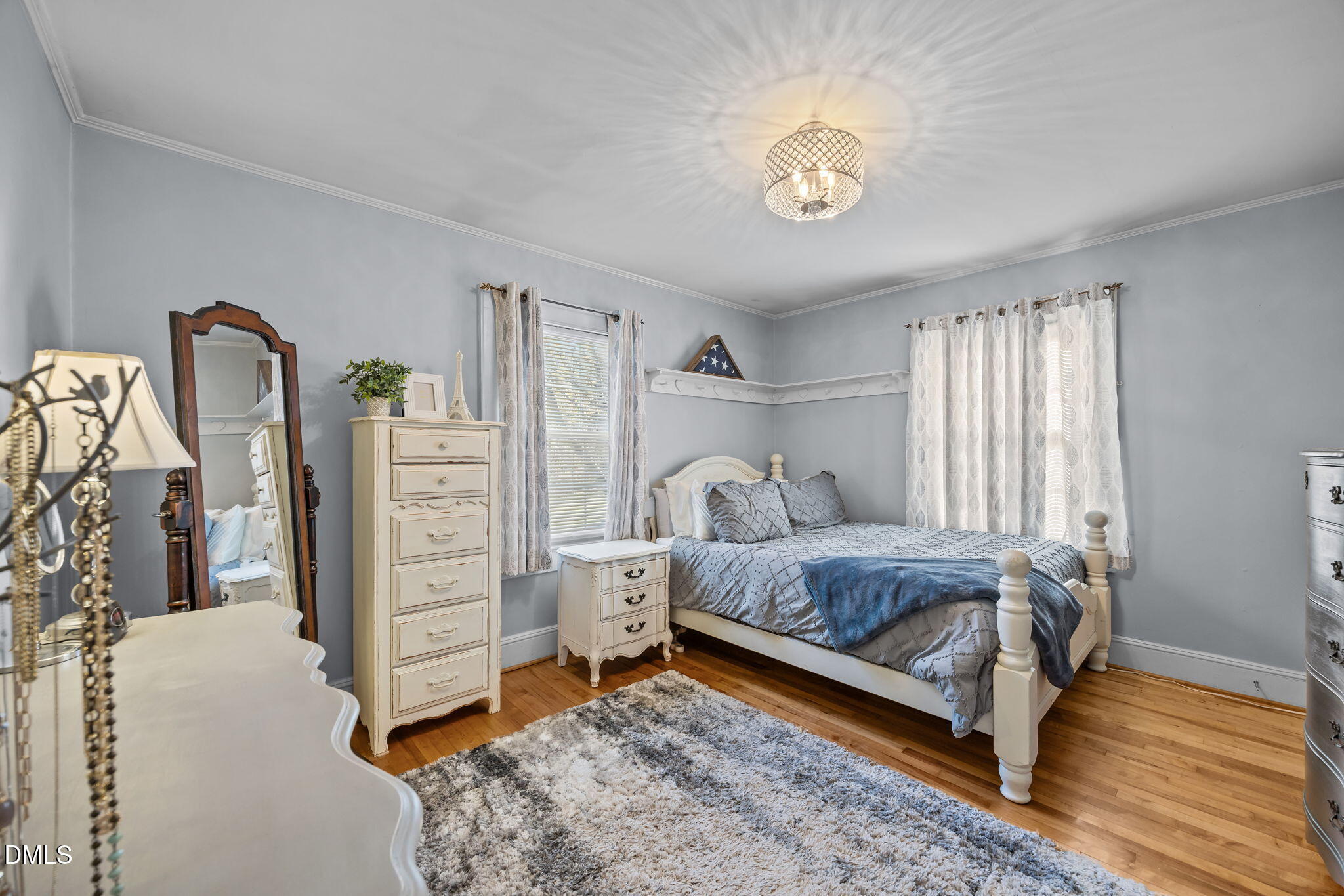 128 Moore Street Graham, NC 27253 - Photo 18 of 45 a bed room with a bed and a chair