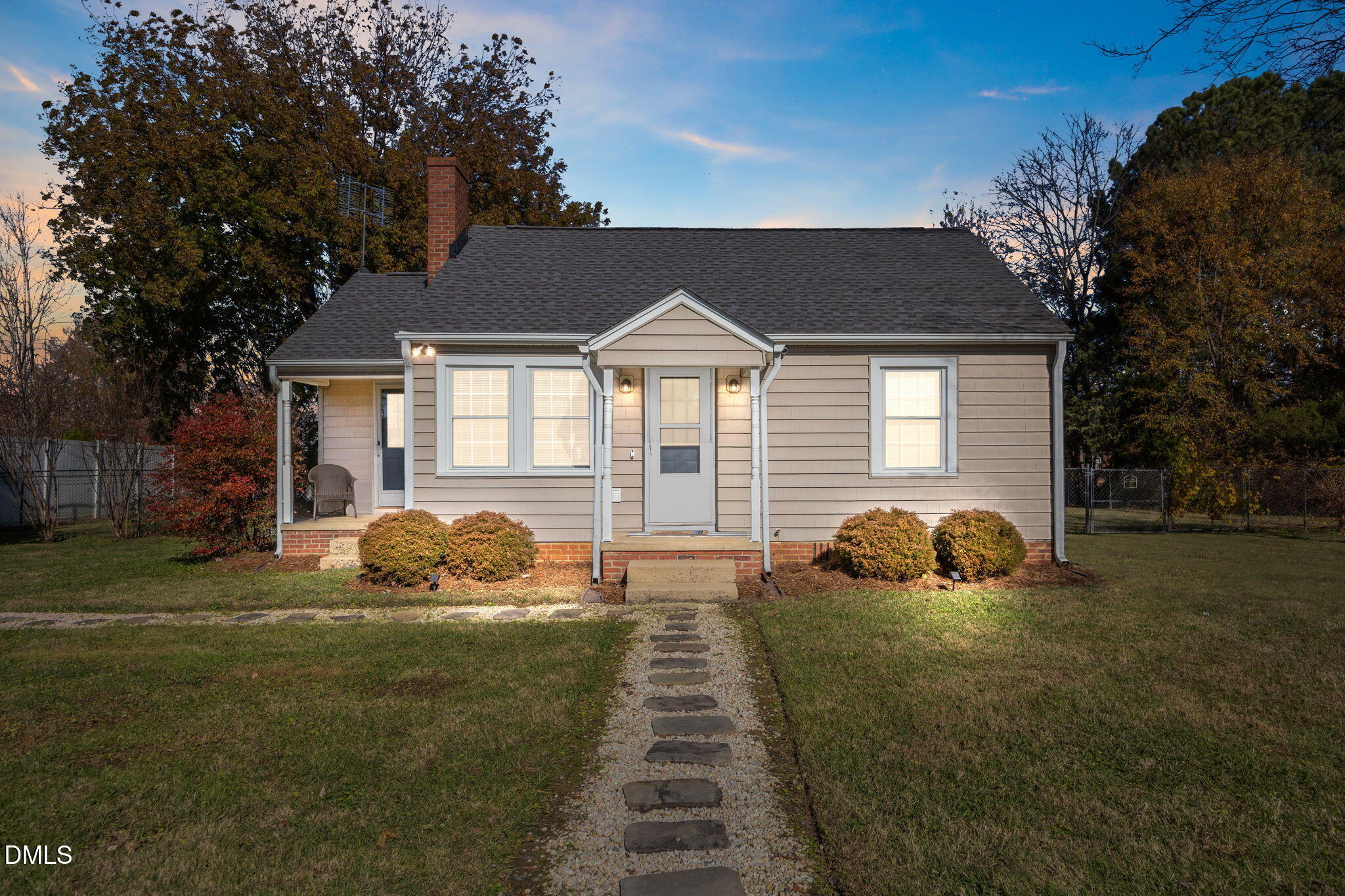 128 Moore Street Graham, NC 27253 - Photo 2 of 45 a front view of a house with yard and green space