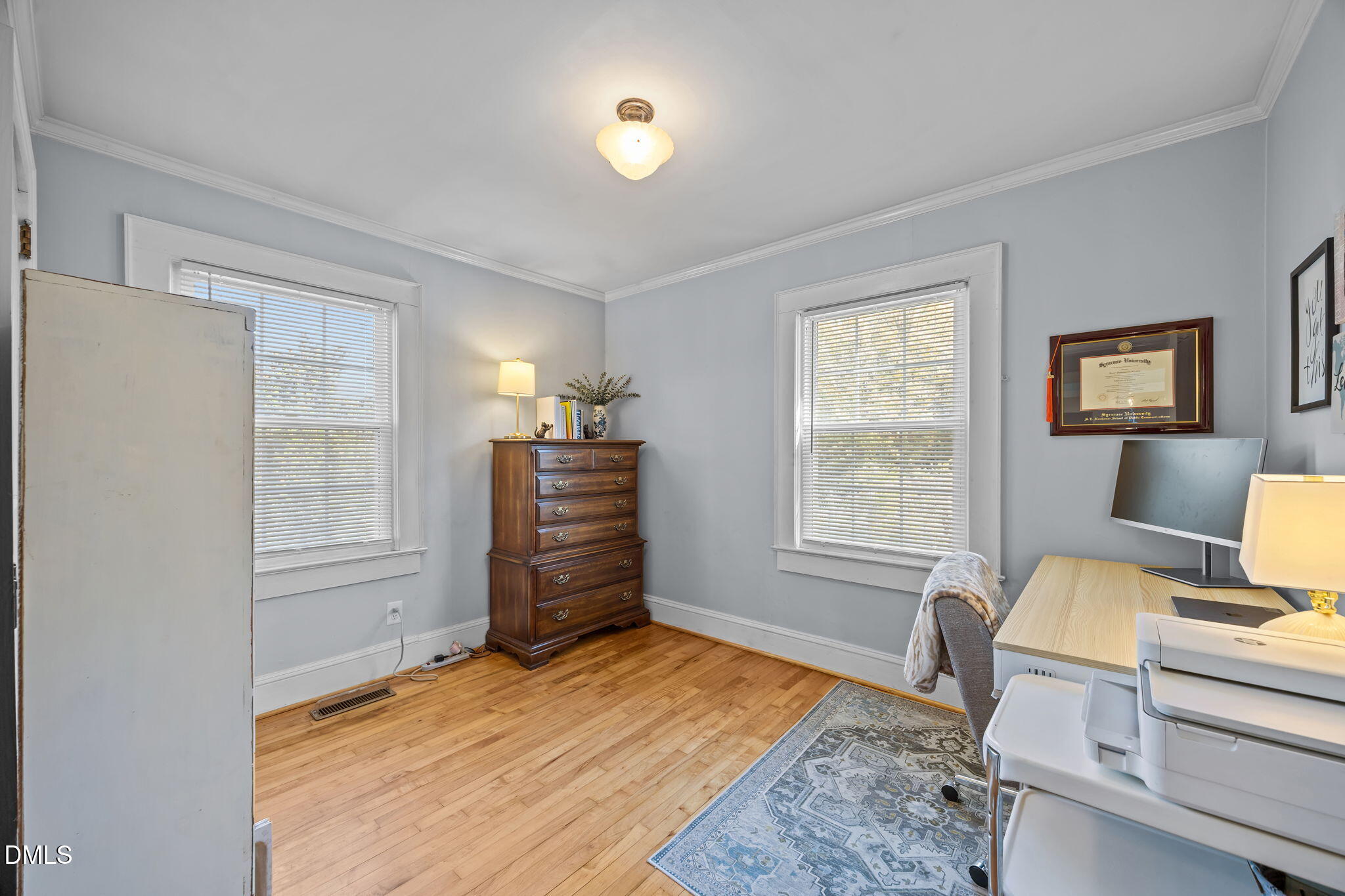 128 Moore Street Graham, NC 27253 - Photo 21 of 45 a bedroom with a bed and wooden floor