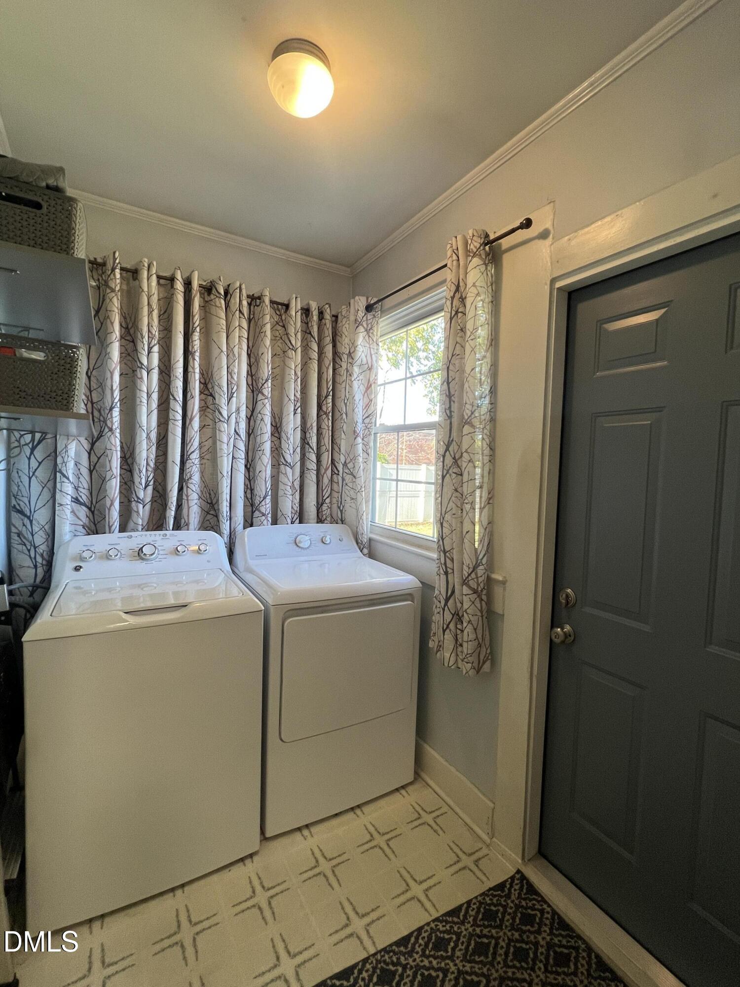 128 Moore Street Graham, NC 27253 - Photo 25 of 45 a utility room with dryer and washer
