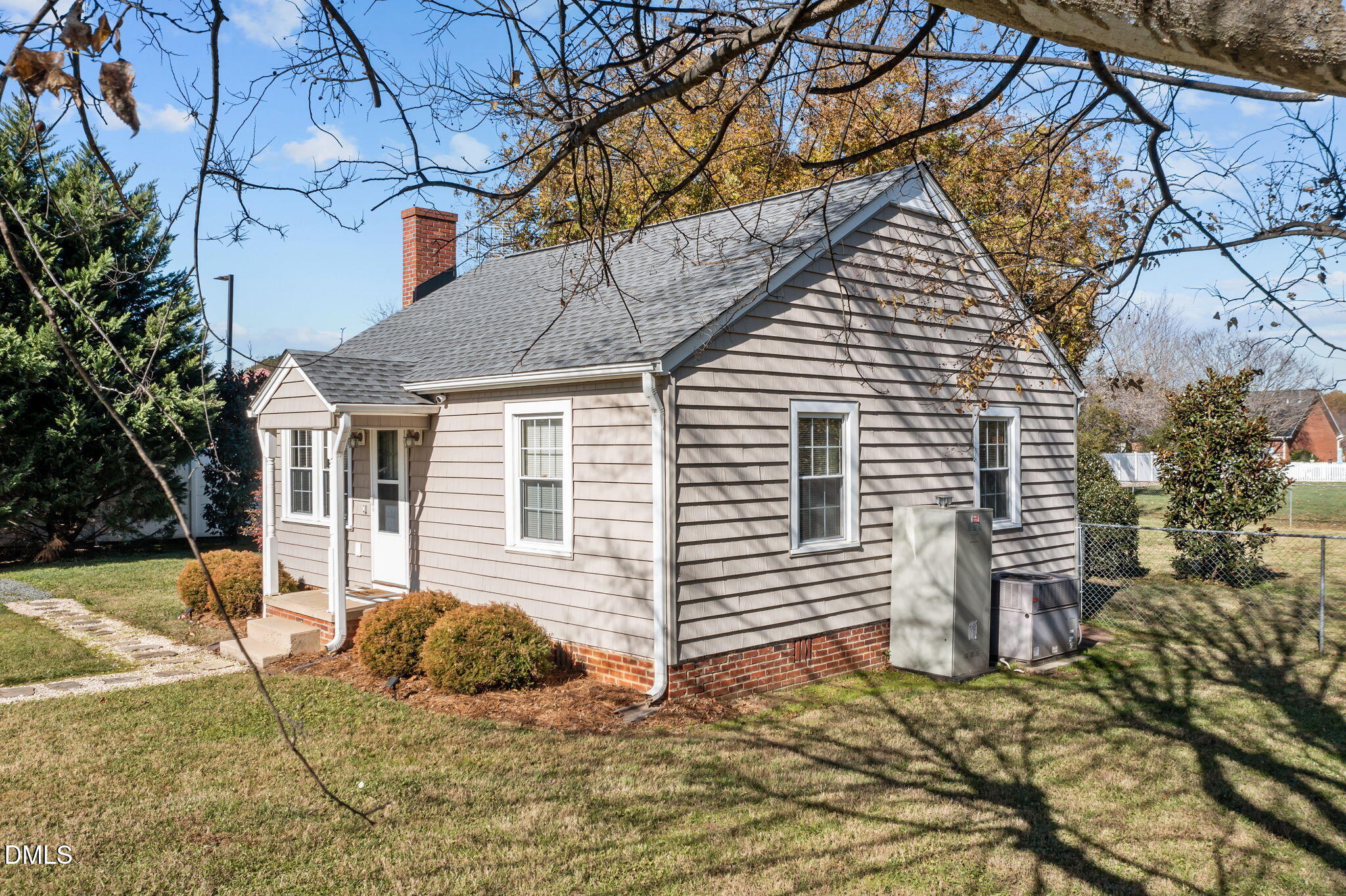 128 Moore Street Graham, NC 27253 - Photo 28 of 45 a front view of a house with a yard