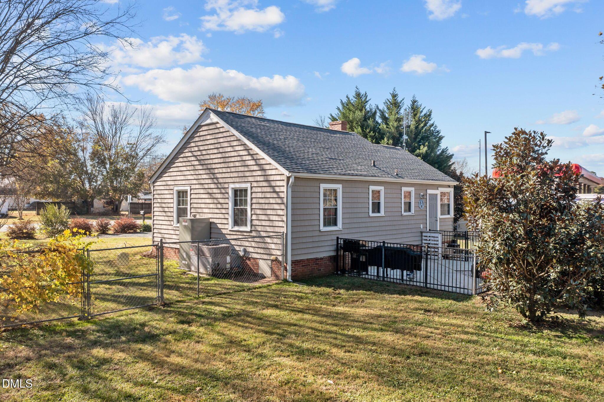 128 Moore Street Graham, NC 27253 - Photo 29 of 45 a view of a house with a yard