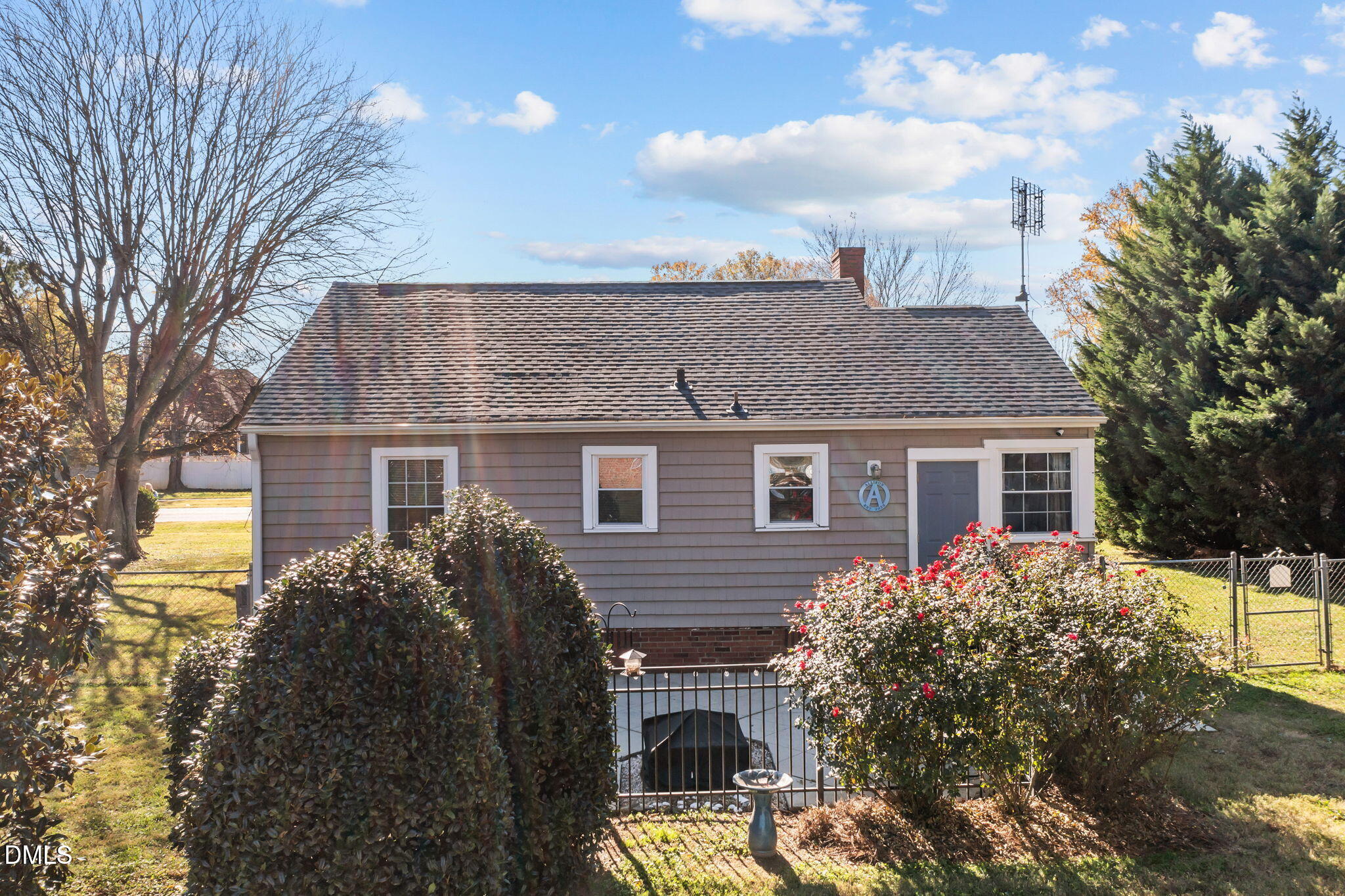 128 Moore Street Graham, NC 27253 - Photo 30 of 45 a front view of house with yard and trees around