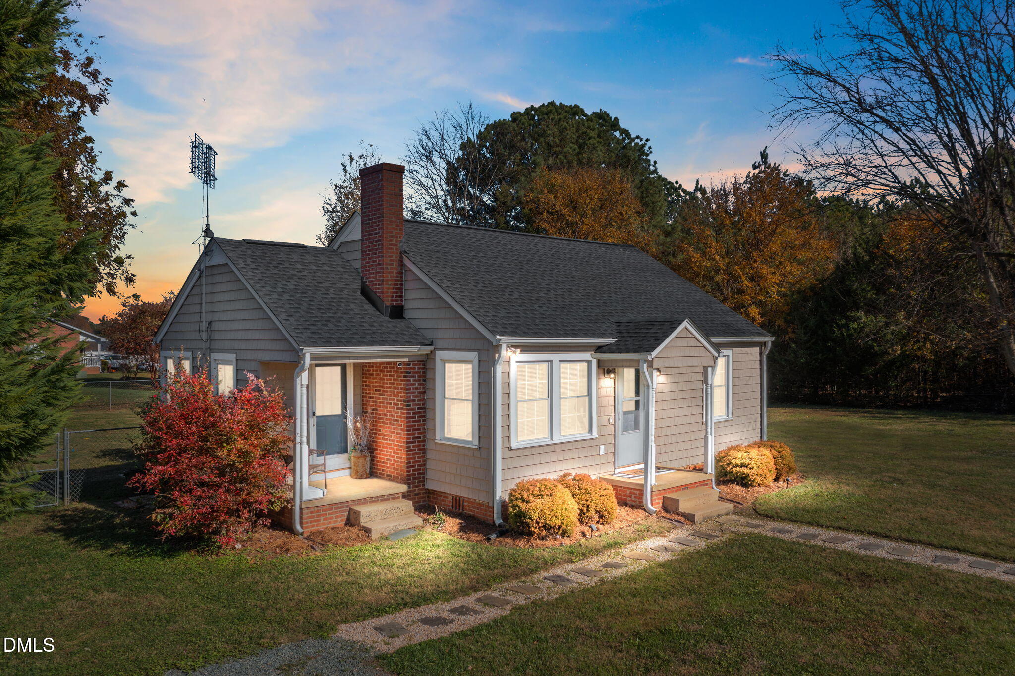 128 Moore Street Graham, NC 27253 - Photo 3 of 45 a front view of a house with garden