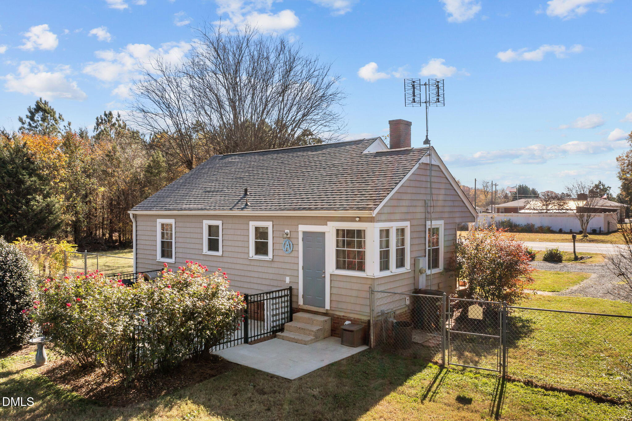 128 Moore Street Graham, NC 27253 - Photo 31 of 45 a view of a house with backyard and sitting area