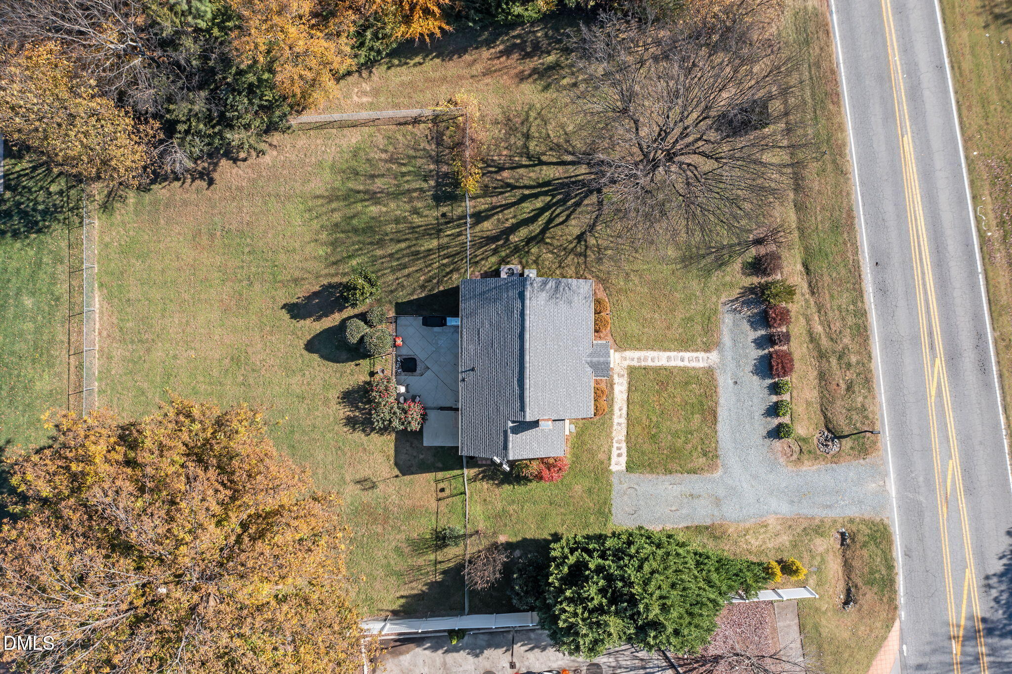 128 Moore Street Graham, NC 27253 - Photo 32 of 45 a view of a pathway of a house with trees