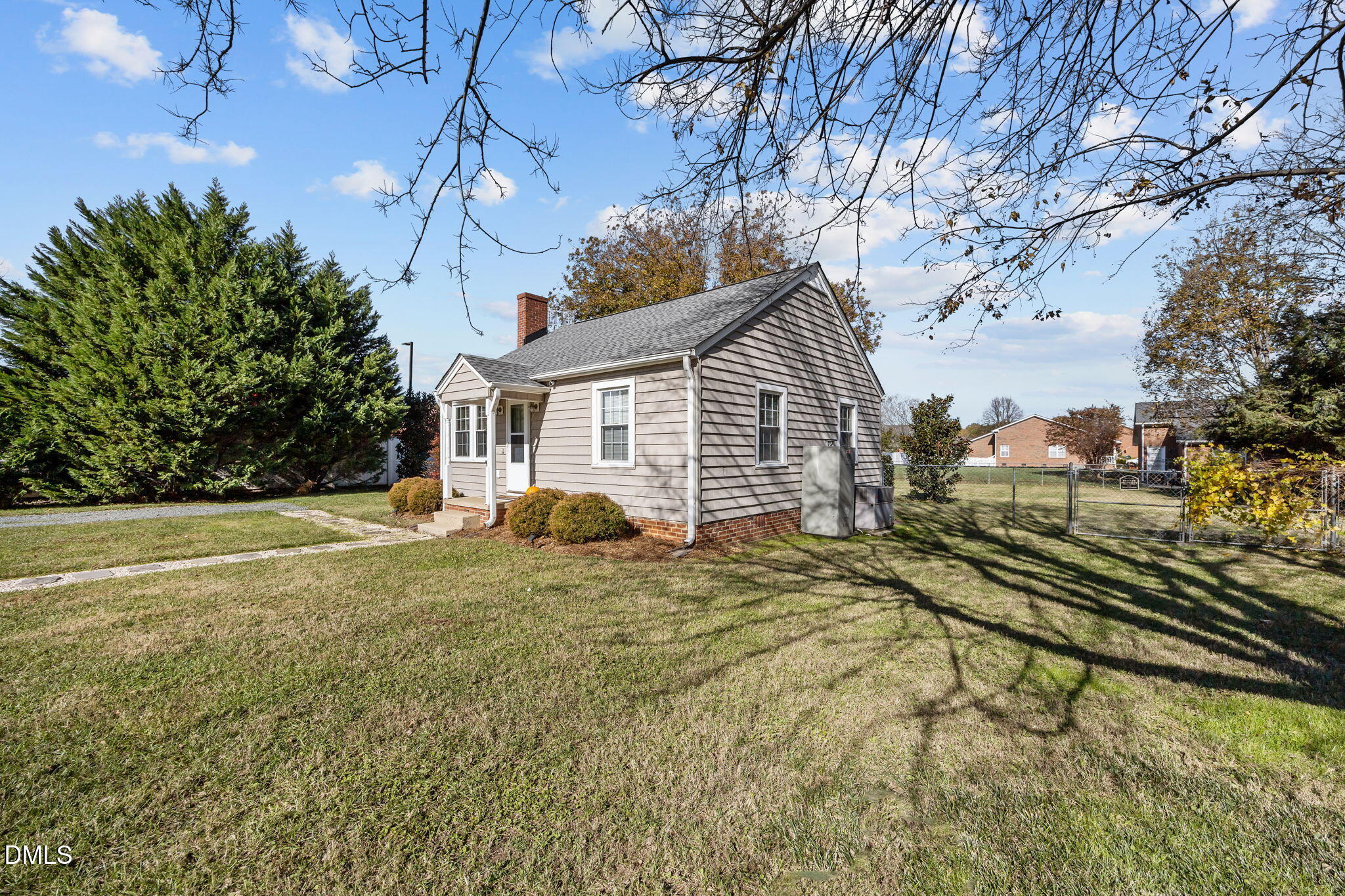 128 Moore Street Graham, NC 27253 - Photo 36 of 45 a view of a house with a yard