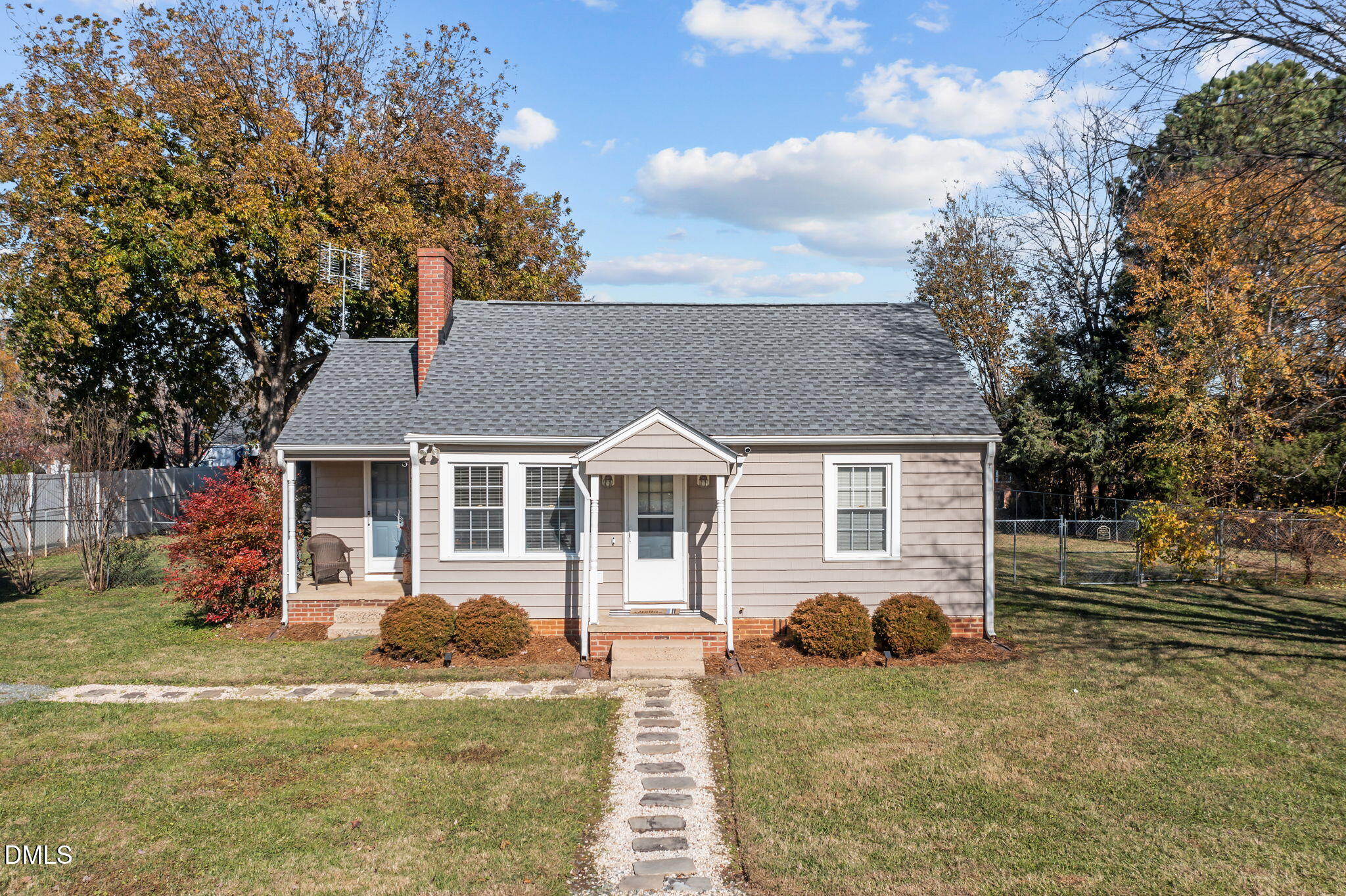 128 Moore Street Graham, NC 27253 - Photo 4 of 45 front view of a house with a yard
