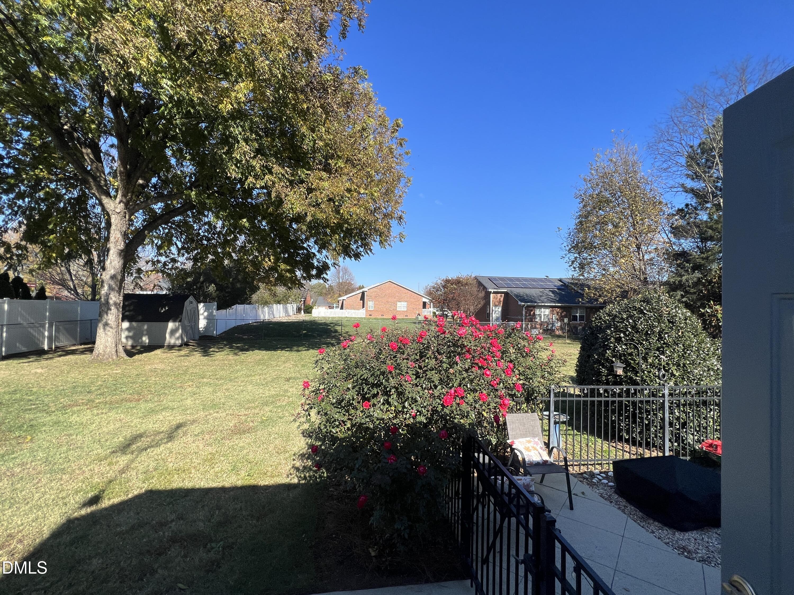 128 Moore Street Graham, NC 27253 - Photo 45 of 45 a view of a house with a yard and garden