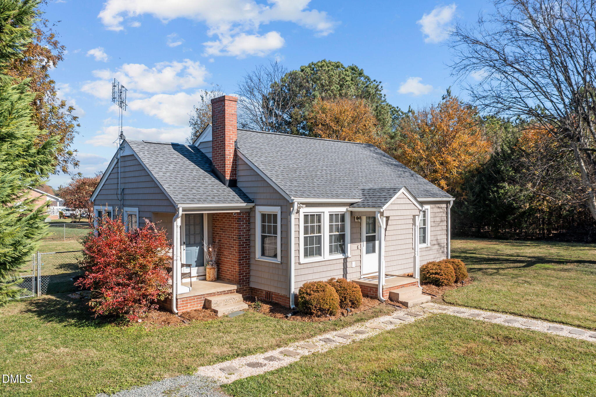 128 Moore Street Graham, NC 27253 - Photo 5 of 45 a front view of a house with garden