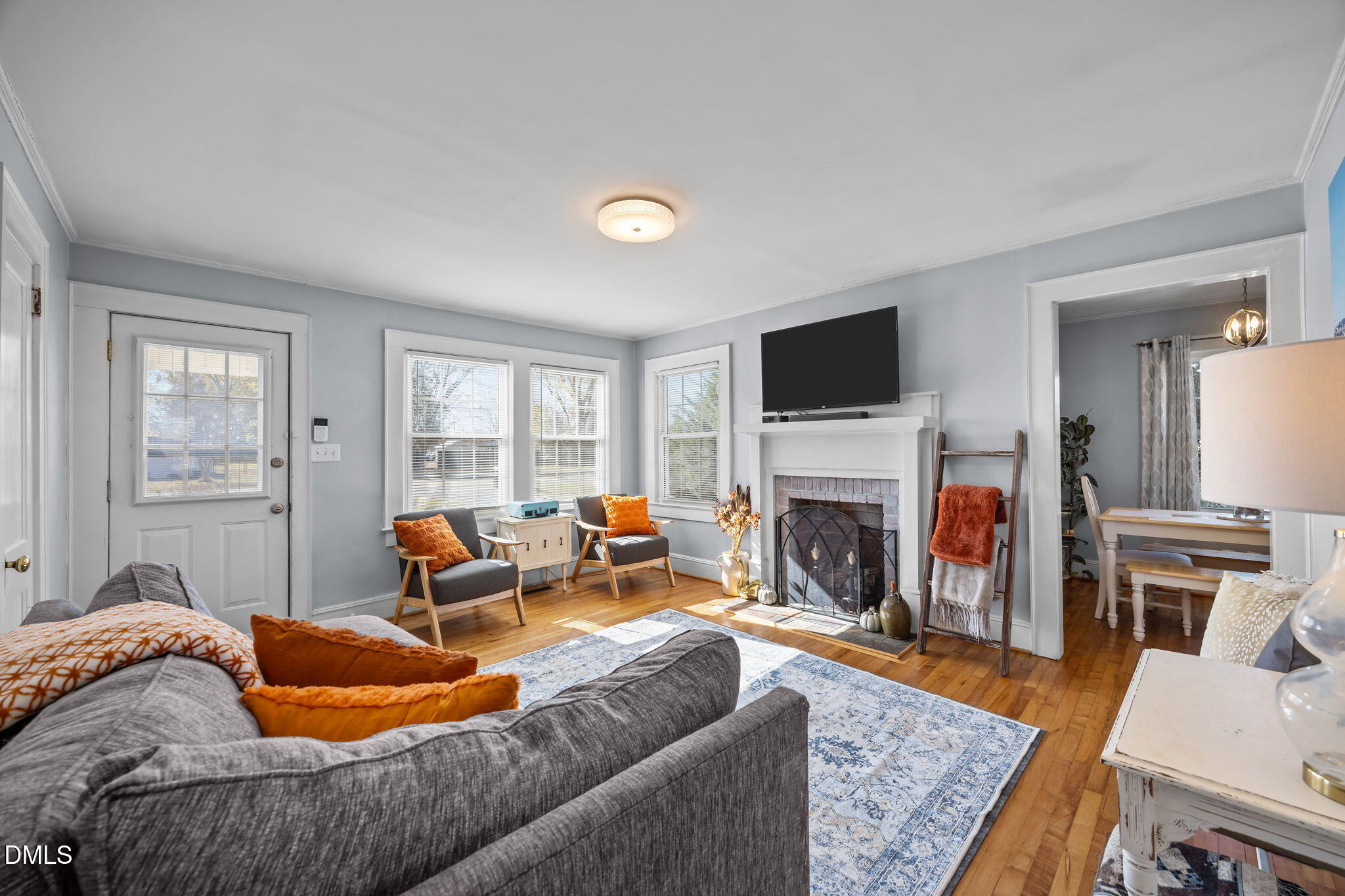 128 Moore Street Graham, NC 27253 - Photo 7 of 45 a living room with furniture and a fireplace