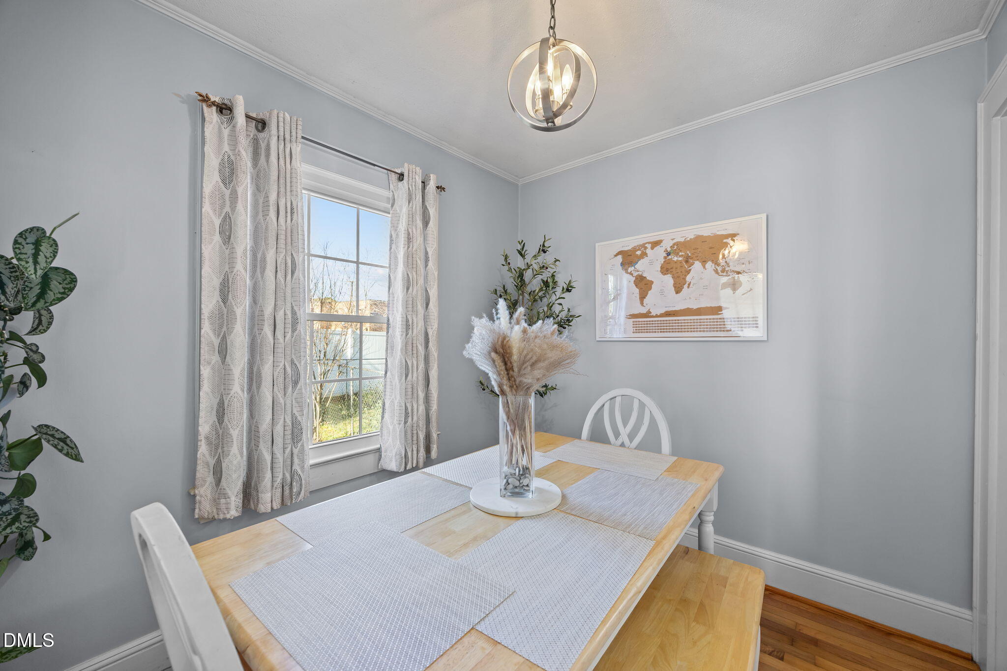 128 Moore Street Graham, NC 27253 - Photo 9 of 45 a view of a dining room with furniture window and wooden floor