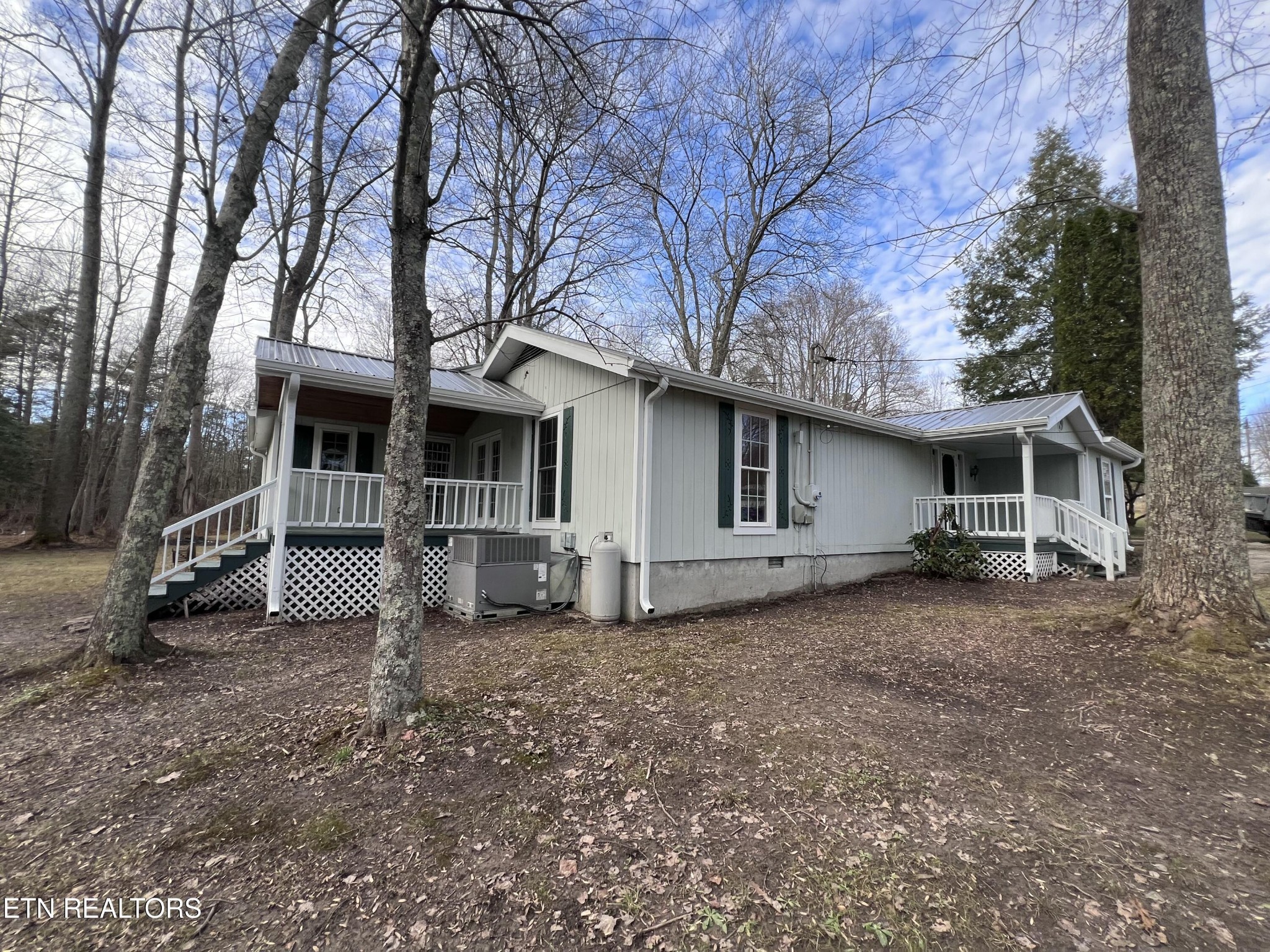1028 Kennedy Road Jamestown, TN 38556 - Photo 45 of 51 a view of a house with a large tree and a yard