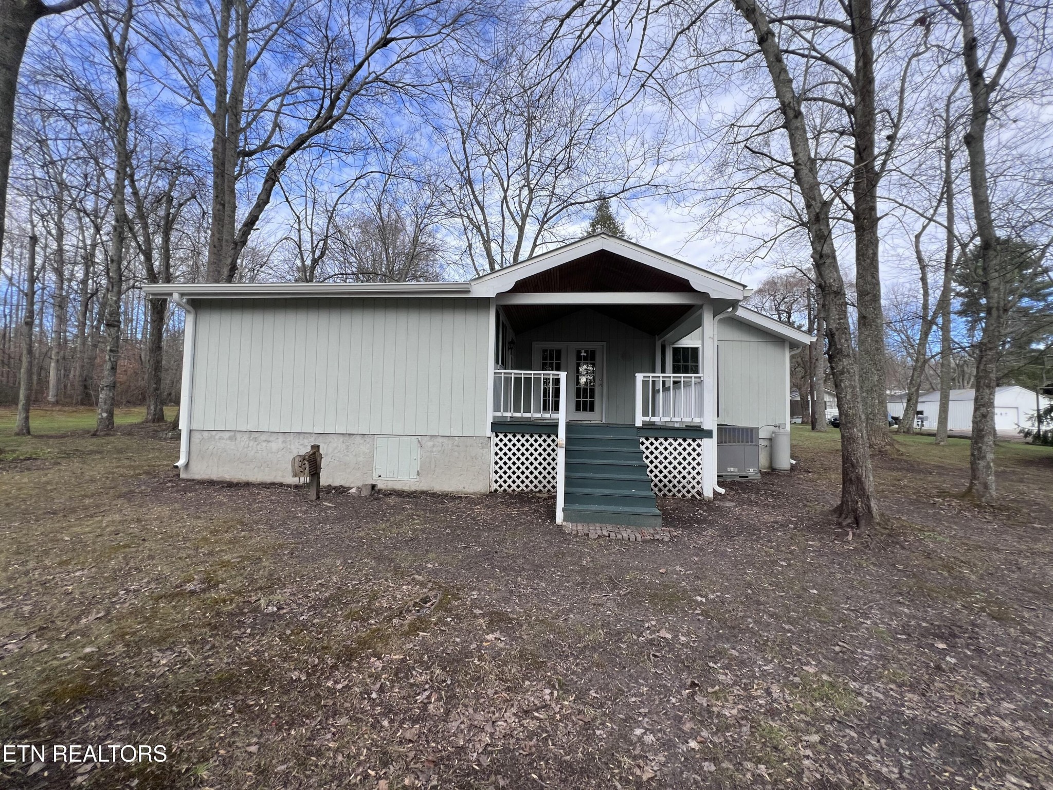 1028 Kennedy Road Jamestown, TN 38556 - Photo 47 of 51 a front view of a house with a yard