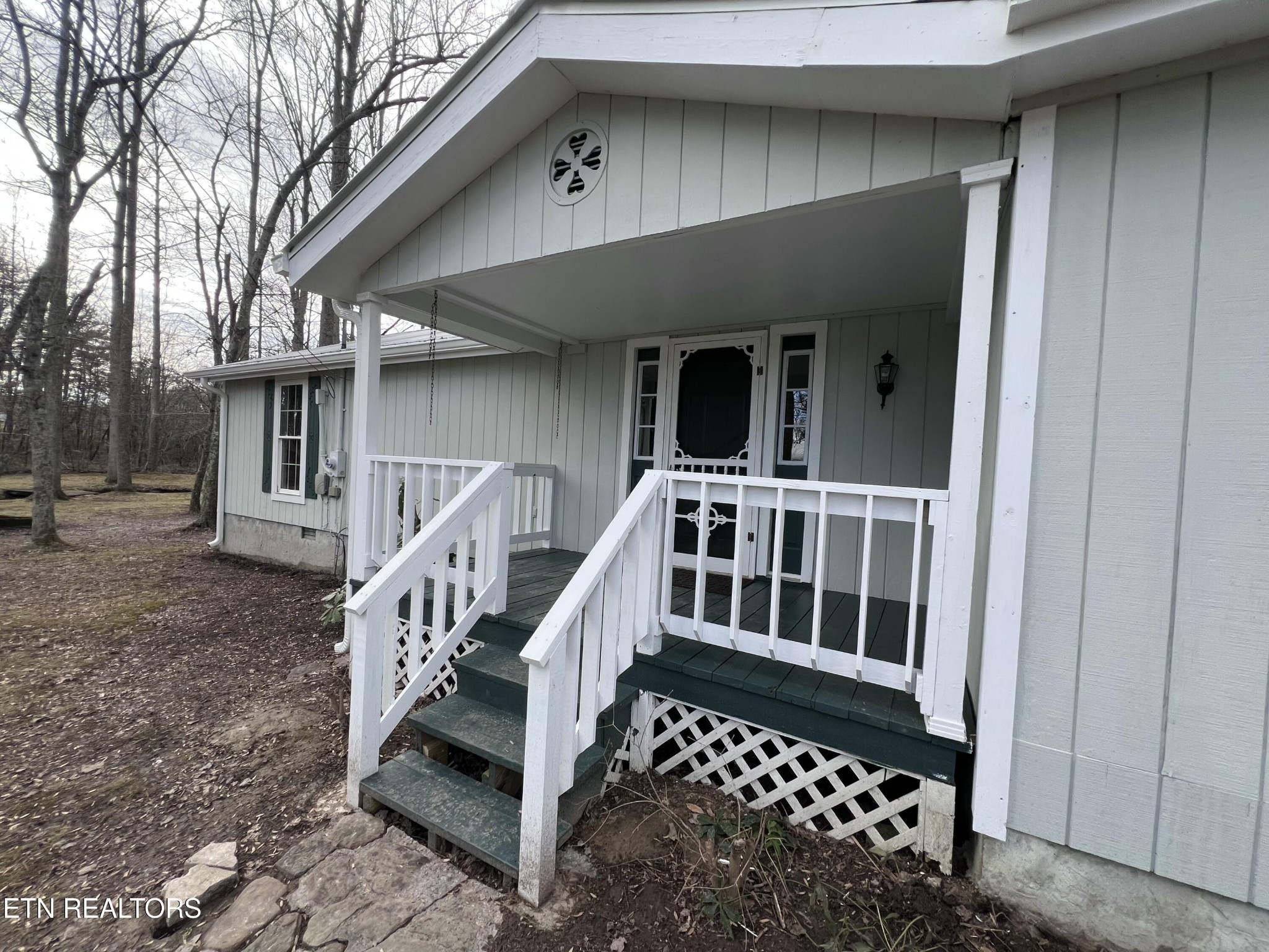 1028 Kennedy Road Jamestown, TN 38556 - Photo 10 of 51 a view of a house with wooden deck and a floor to ceiling window