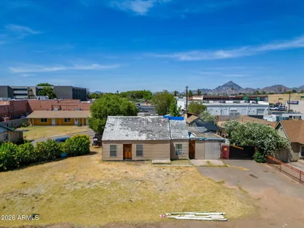 a view of a city with a building in the background