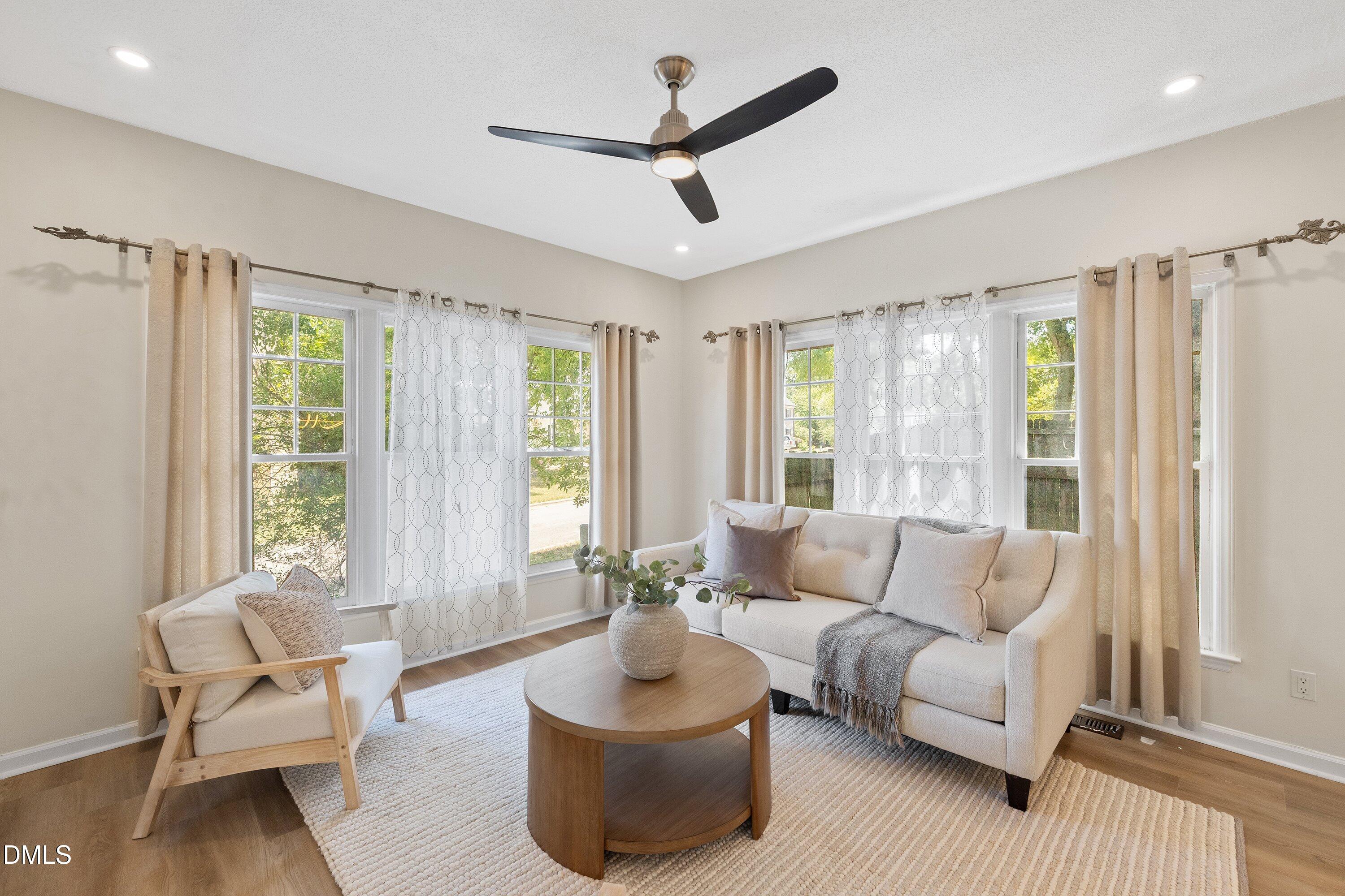 2517 Birchford Court Raleigh, NC 27604 - Photo 18 of 63 a living room with furniture and a large window