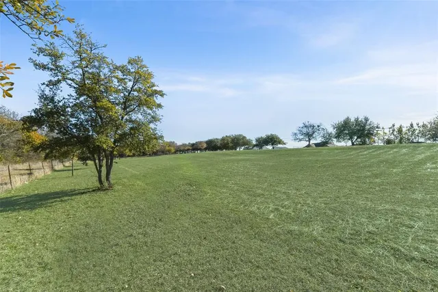 a view of lake with green space