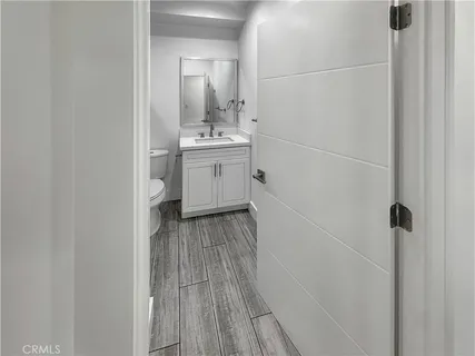 a view of a bathroom with a sink and mirror