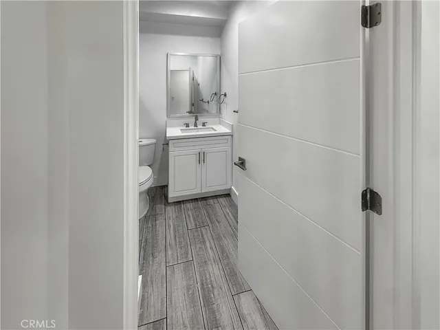 a view of a bathroom with a sink and mirror
