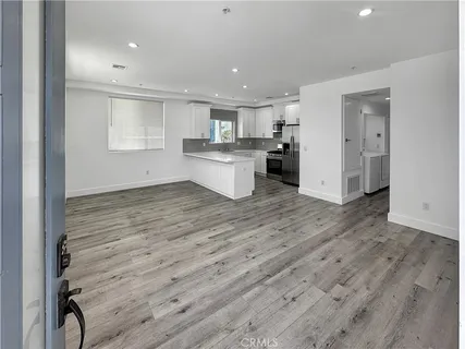 a view of kitchen with wooden floor