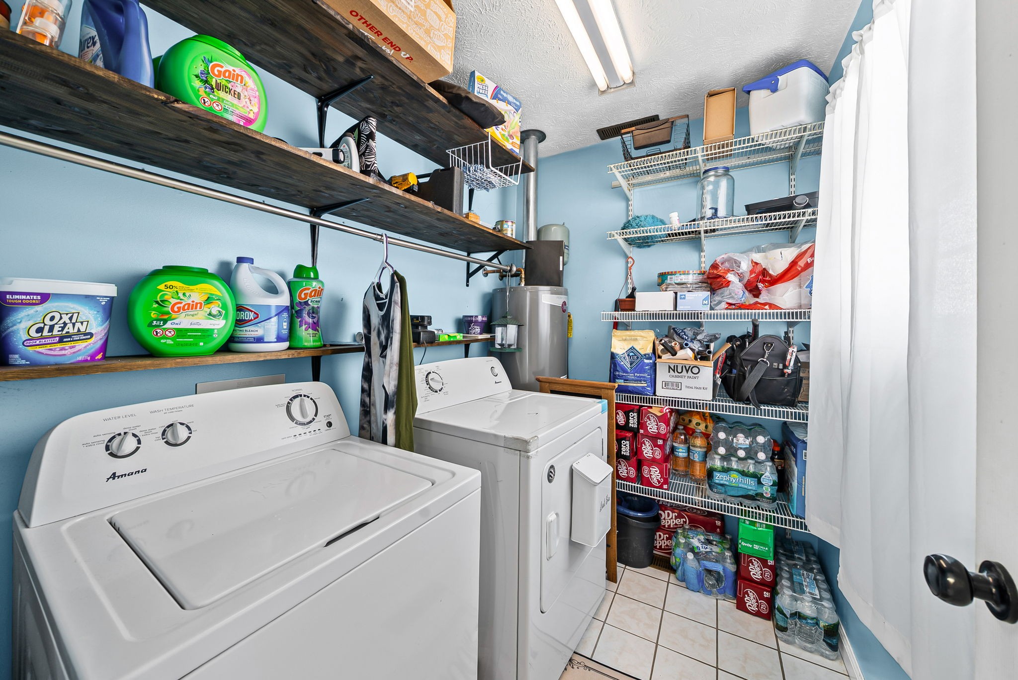 126 Flowers Road Crofton, KY 42217 - Photo 13 of 34 a utility room with lots of clutter and storage