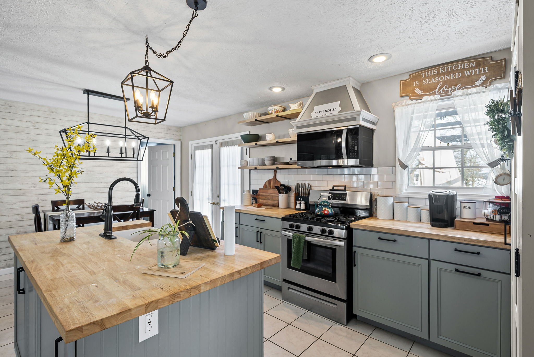 126 Flowers Road Crofton, KY 42217 - Photo 14 of 41 a kitchen with sink a stove and cabinets