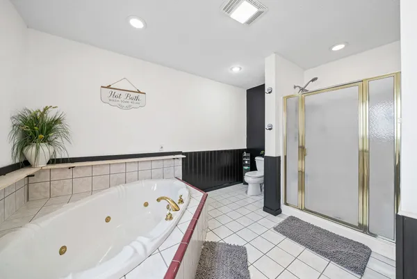 a bathroom with a bathtub and a shower