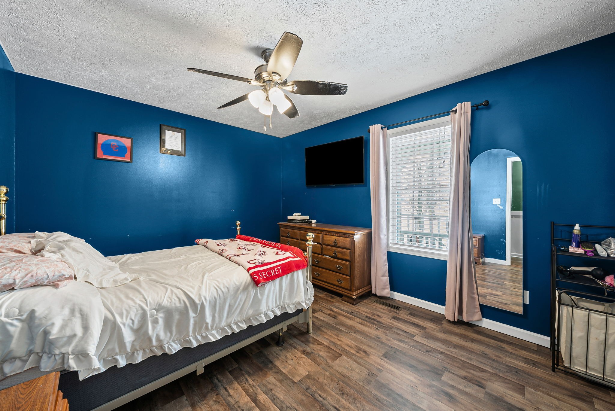 126 Flowers Road Crofton, KY 42217 - Photo 18 of 34 a bedroom with a bed and a chandelier