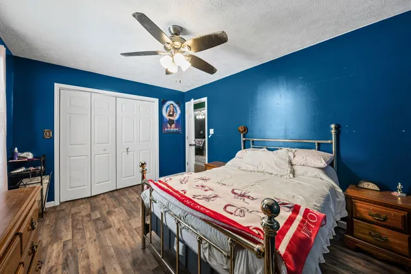 a bed room with a bed and a chandelier