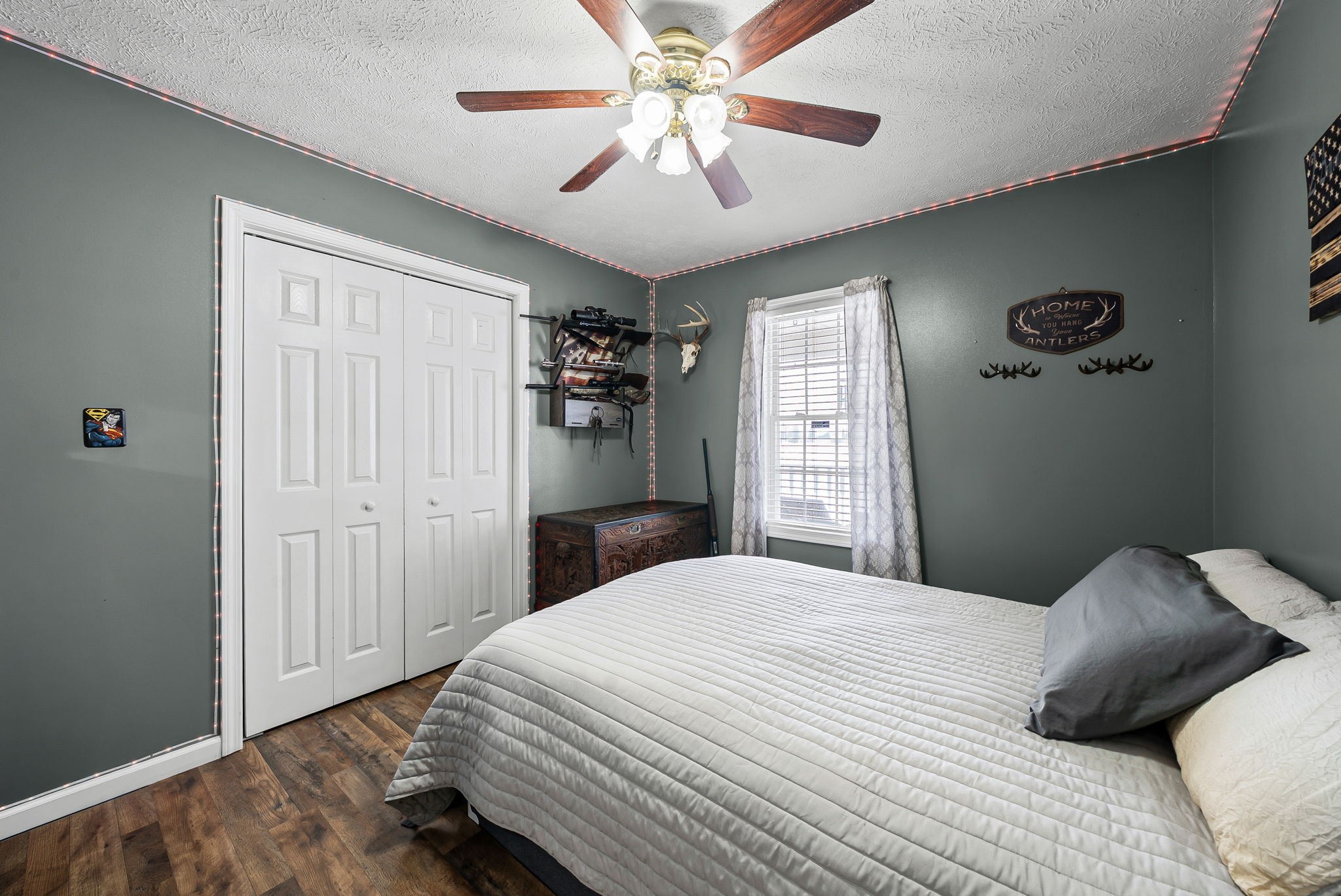 126 Flowers Road Crofton, KY 42217 - Photo 21 of 34 a bedroom with a large bed and a chandelier