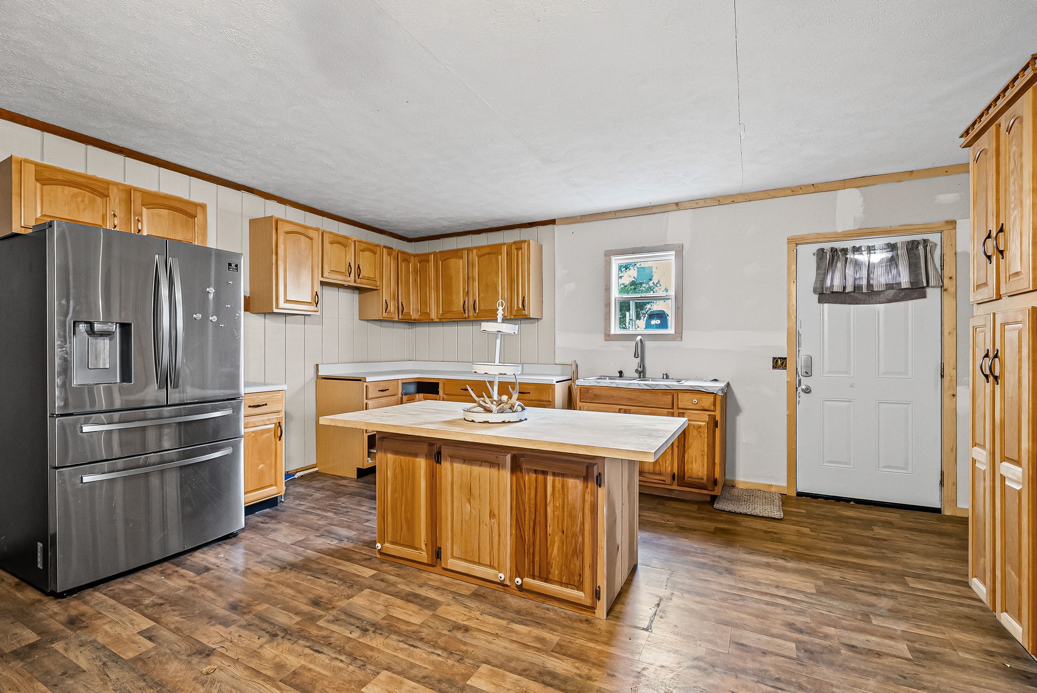 126 Flowers Road Crofton, KY 42217 - Photo 24 of 34 a kitchen with stainless steel appliances granite countertop a refrigerator a sink dishwasher a stove with wooden cabinets and wooden floor