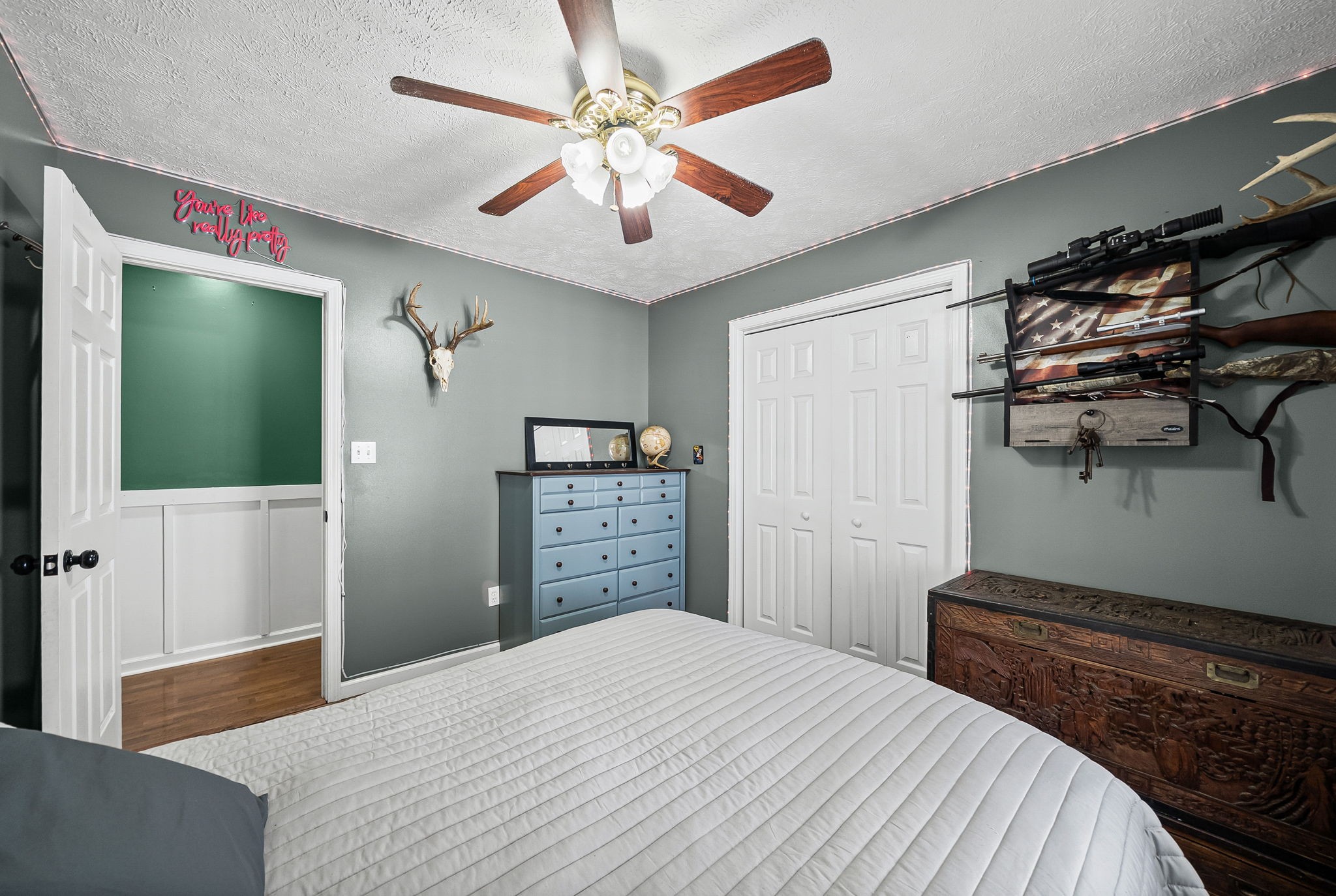 126 Flowers Road Crofton, KY 42217 - Photo 26 of 41 a bedroom with a bed and a chandelier