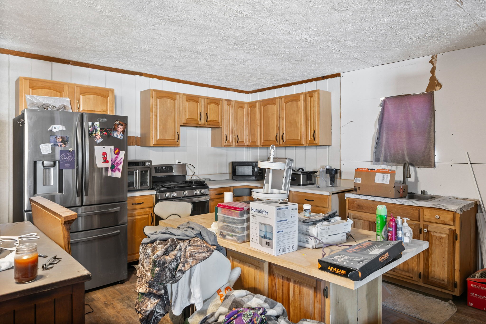 126 Flowers Road Crofton, KY 42217 - Photo 33 of 41 a kitchen with stainless steel appliances granite countertop a stove top oven a sink and cabinets