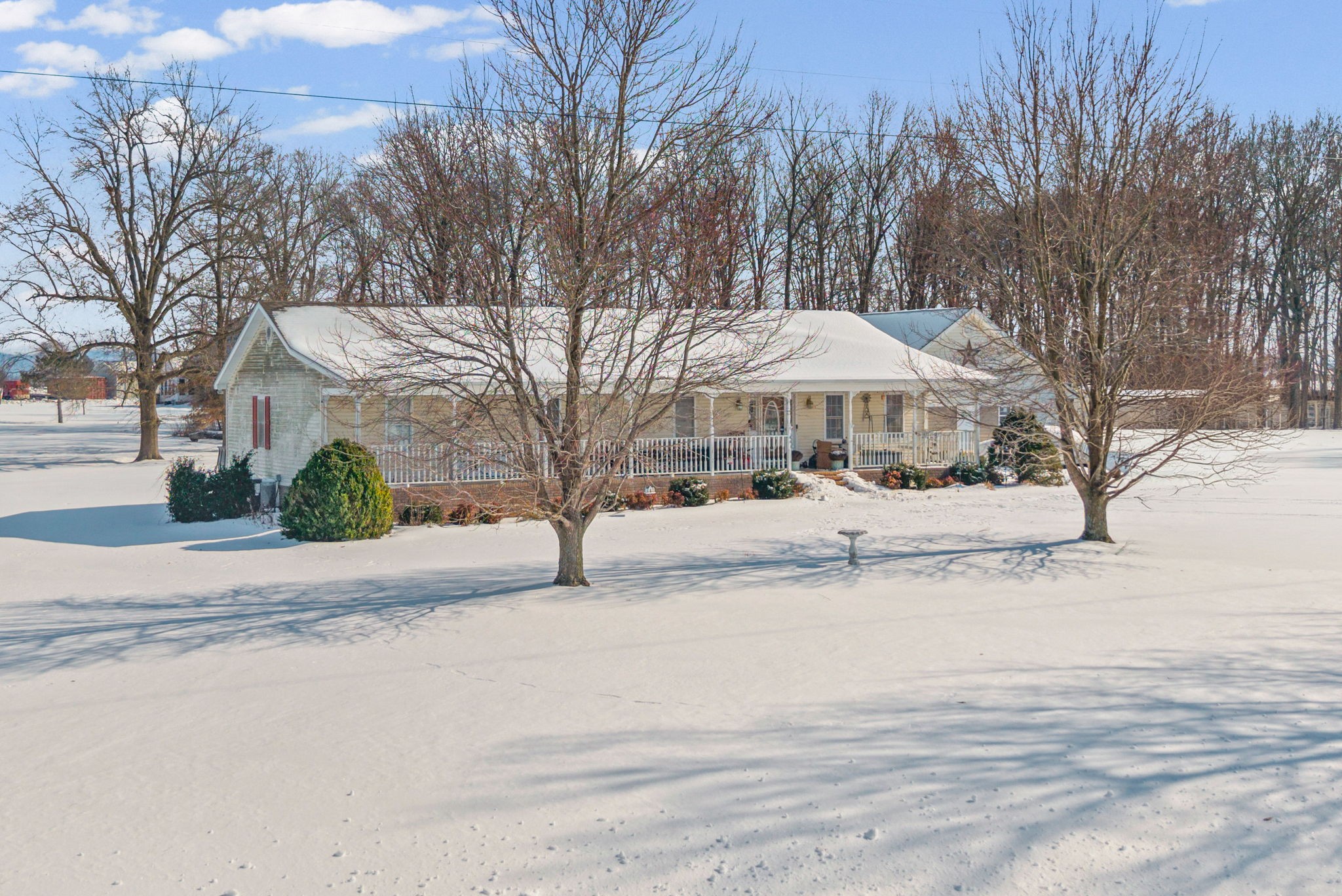 126 Flowers Road Crofton, KY 42217 - Photo 4 of 41 a view of a street with a house on the side