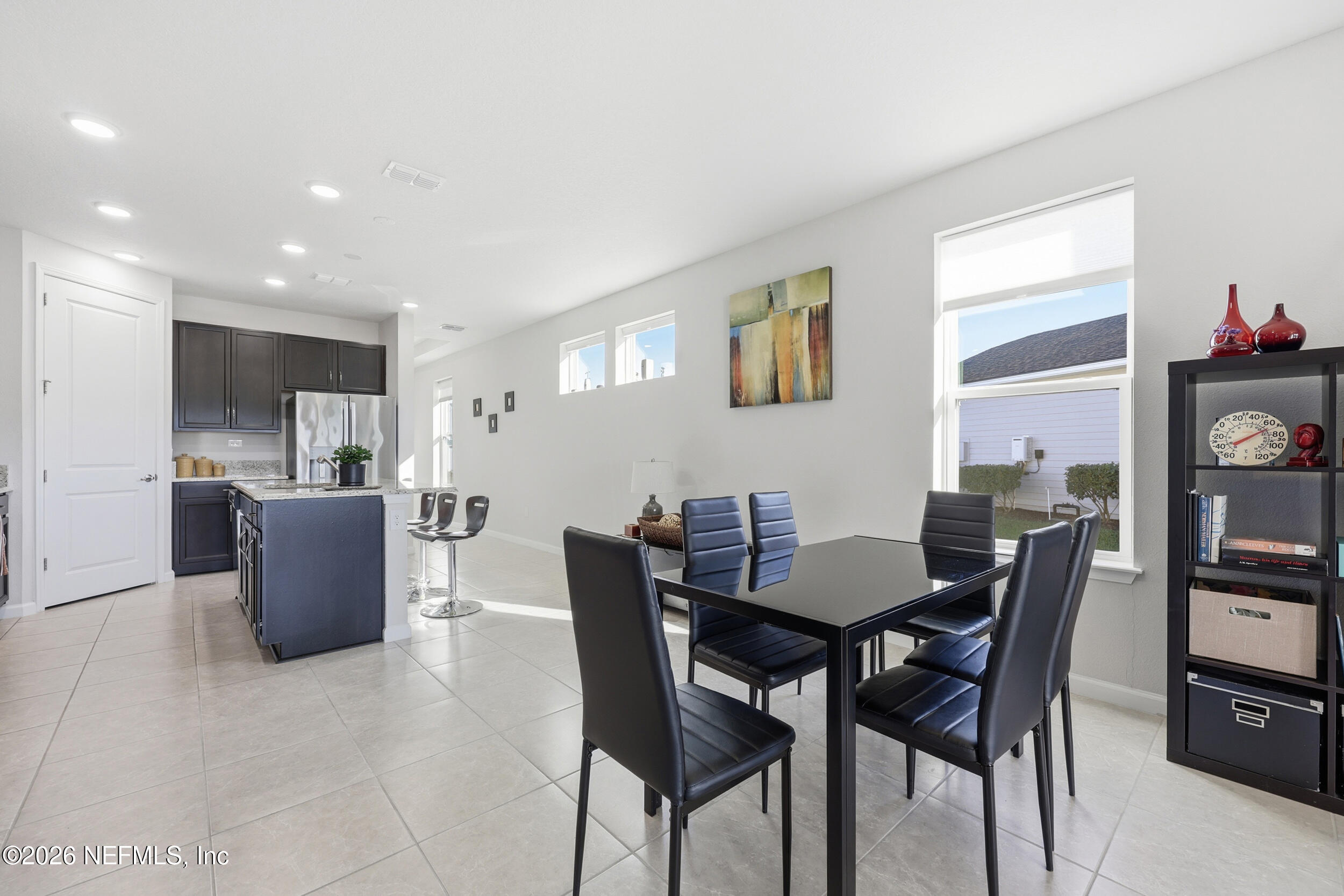 996 Rustic Mill Drive St. Augustine, FL 32092 - Photo 12 of 53 a dining room with furniture and a kitchen view