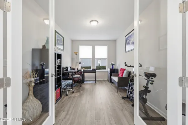 a bathroom with a double vanity sink mirror and shower