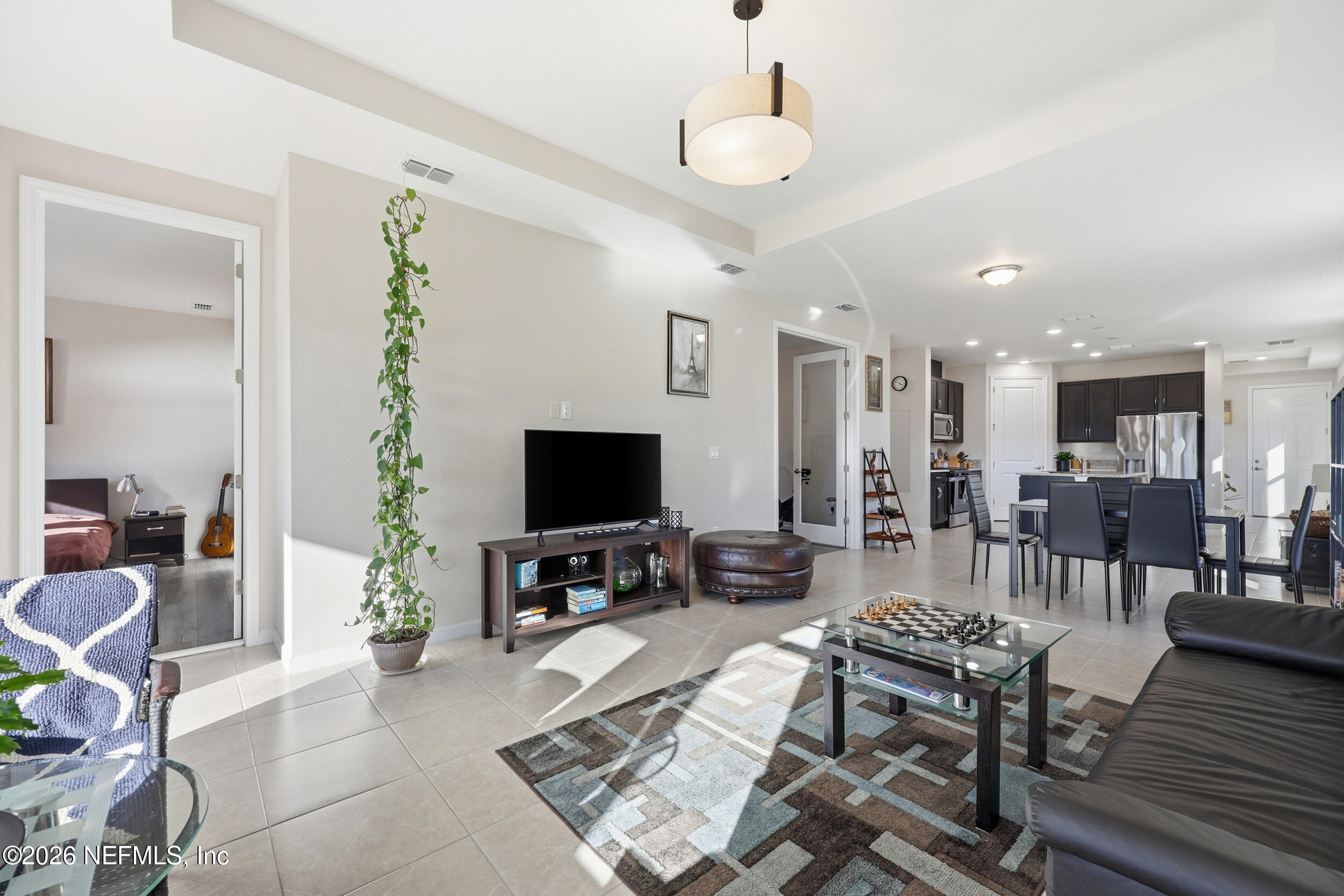 996 Rustic Mill Drive St. Augustine, FL 32092 - Photo 18 of 53 a living room with furniture and a flat screen tv