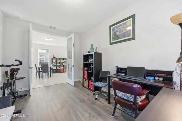a bedroom with a bed and a desk