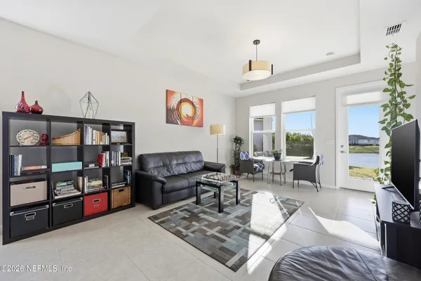 a bathroom with a granite countertop sink toilet a large mirror a shower and a bathroom