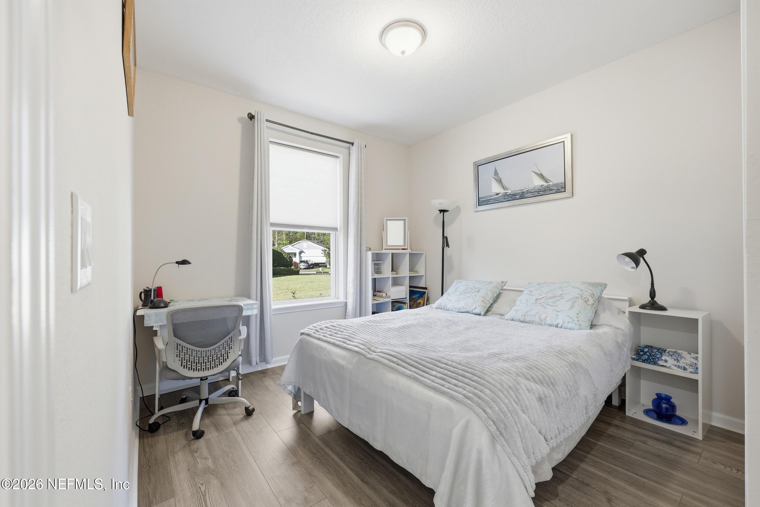 996 Rustic Mill Drive St. Augustine, FL 32092 - Photo 23 of 53 a bedroom with a bed and a desk