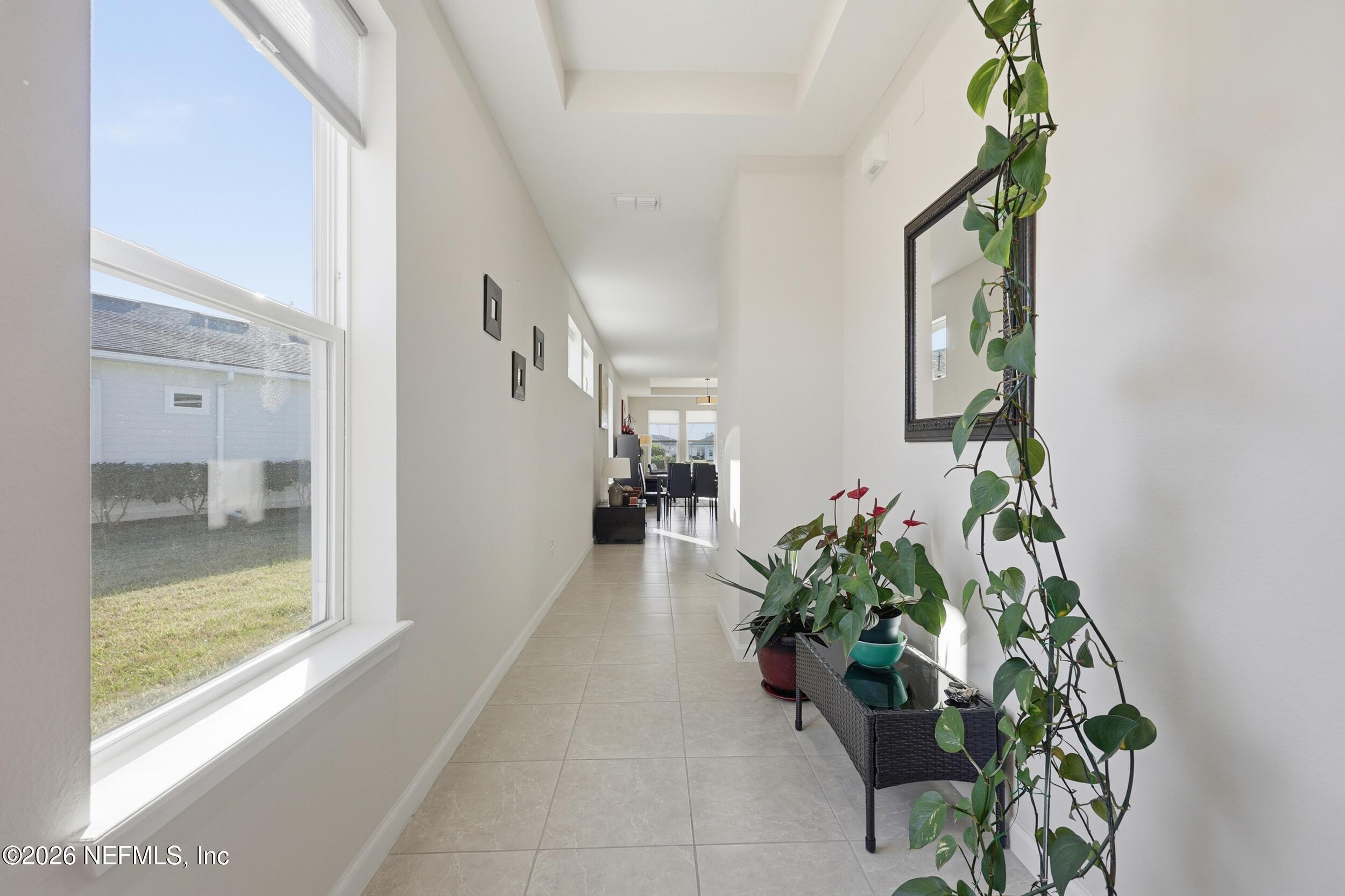 996 Rustic Mill Drive St. Augustine, FL 32092 - Photo 4 of 53 a hallway with beautiful flowers