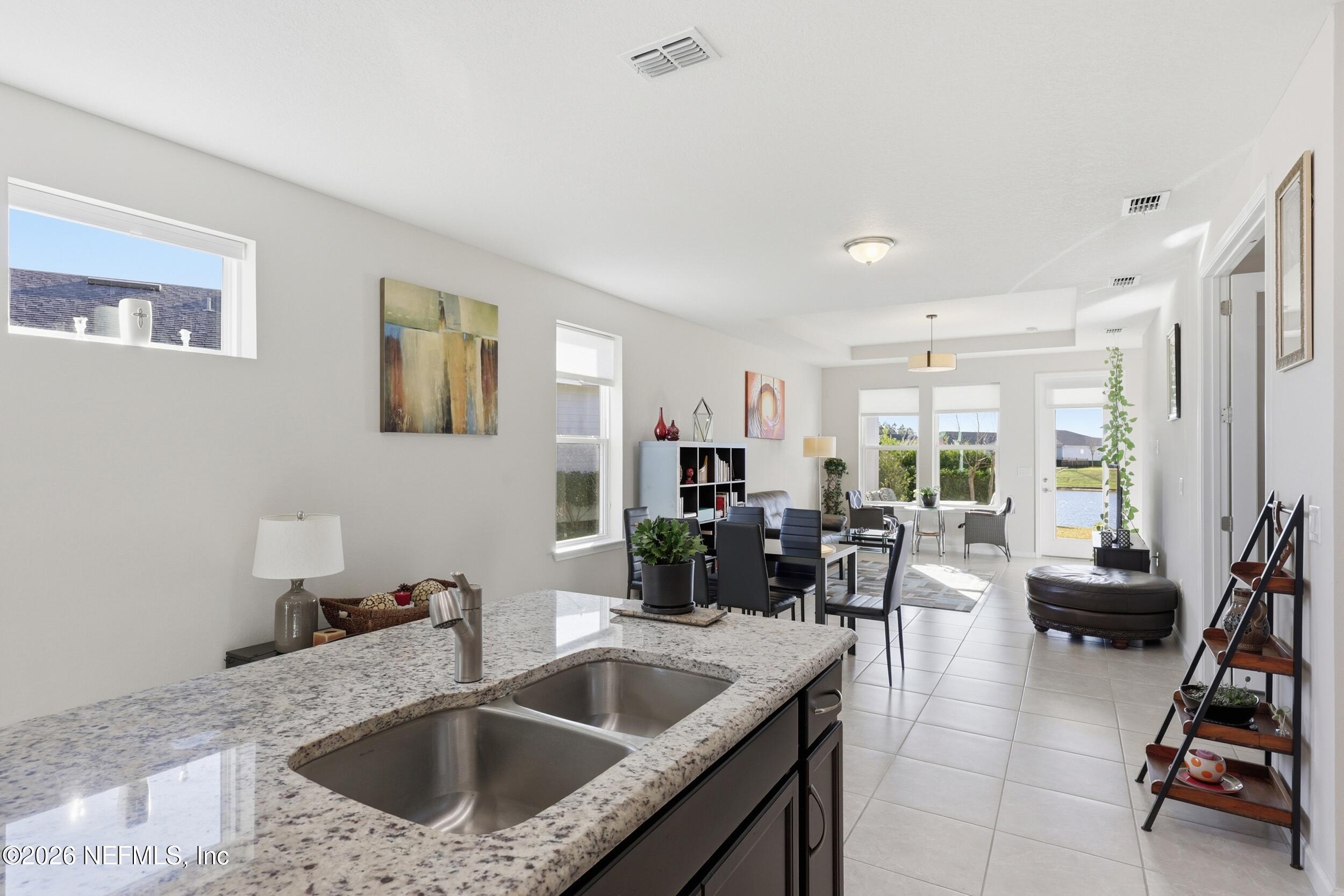 996 Rustic Mill Drive St. Augustine, FL 32092 - Photo 9 of 53 a kitchen with a sink and living room
