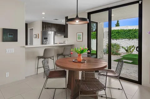 a kitchen with a sink and stainless steel appliances