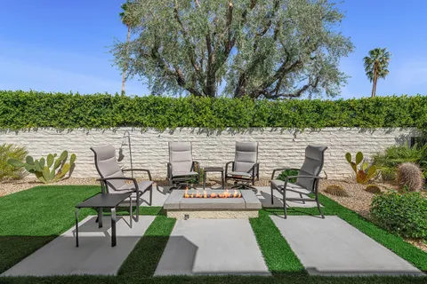 a garden view with a seating space
