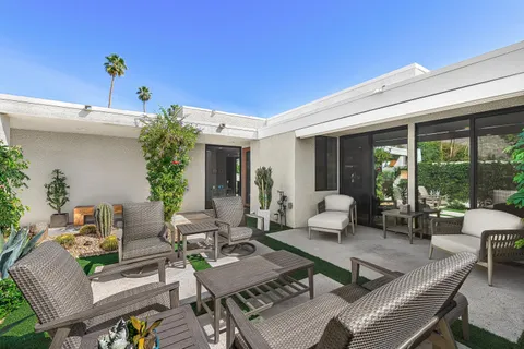 a building outdoor space with patio furniture