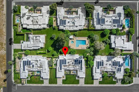 an aerial view of residential houses and outdoor space